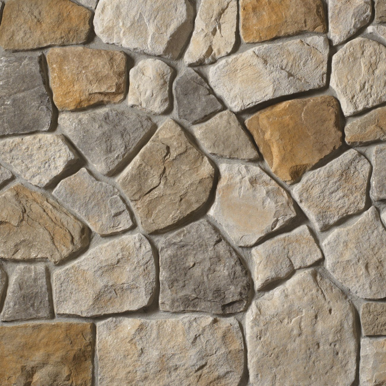 Cultured Stone Aspen Dressed Fieldstone veneer featuring cool neutral tones, chiseled dressed texture, and refined natural stone character.