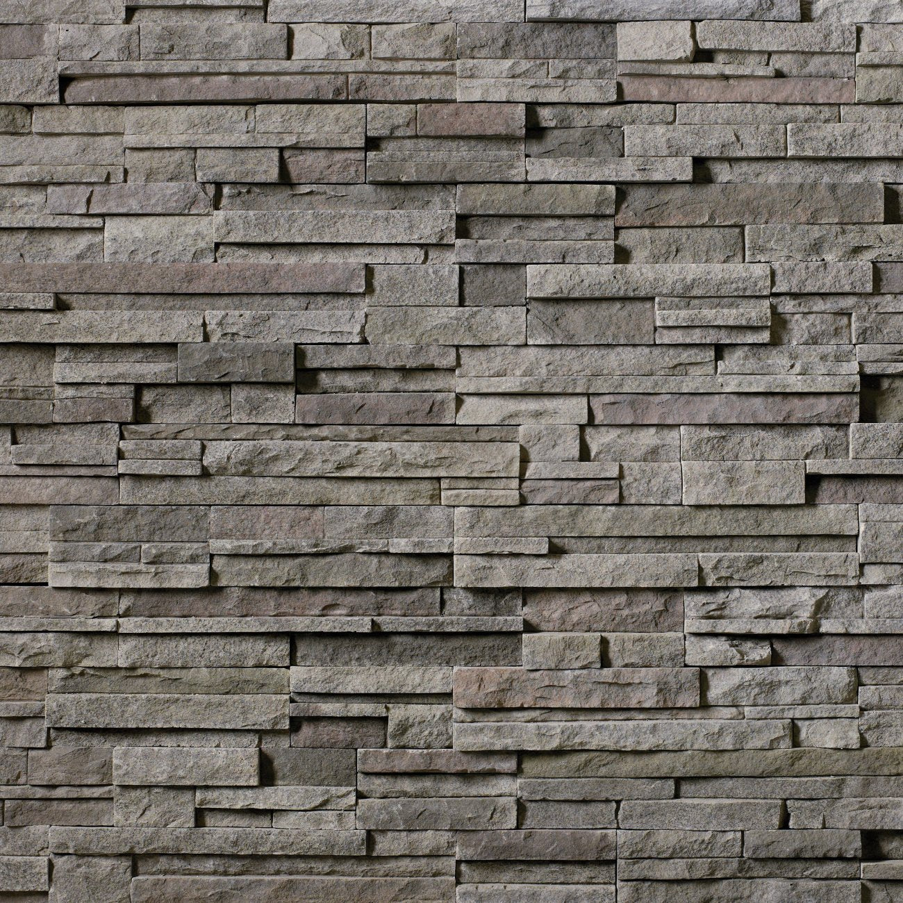 Cultured Stone Black Mountain Pro-Fit Alpine Ledgestone veneer featuring deep charcoal-black tones, rugged stacked texture, and natural stone character in panel form