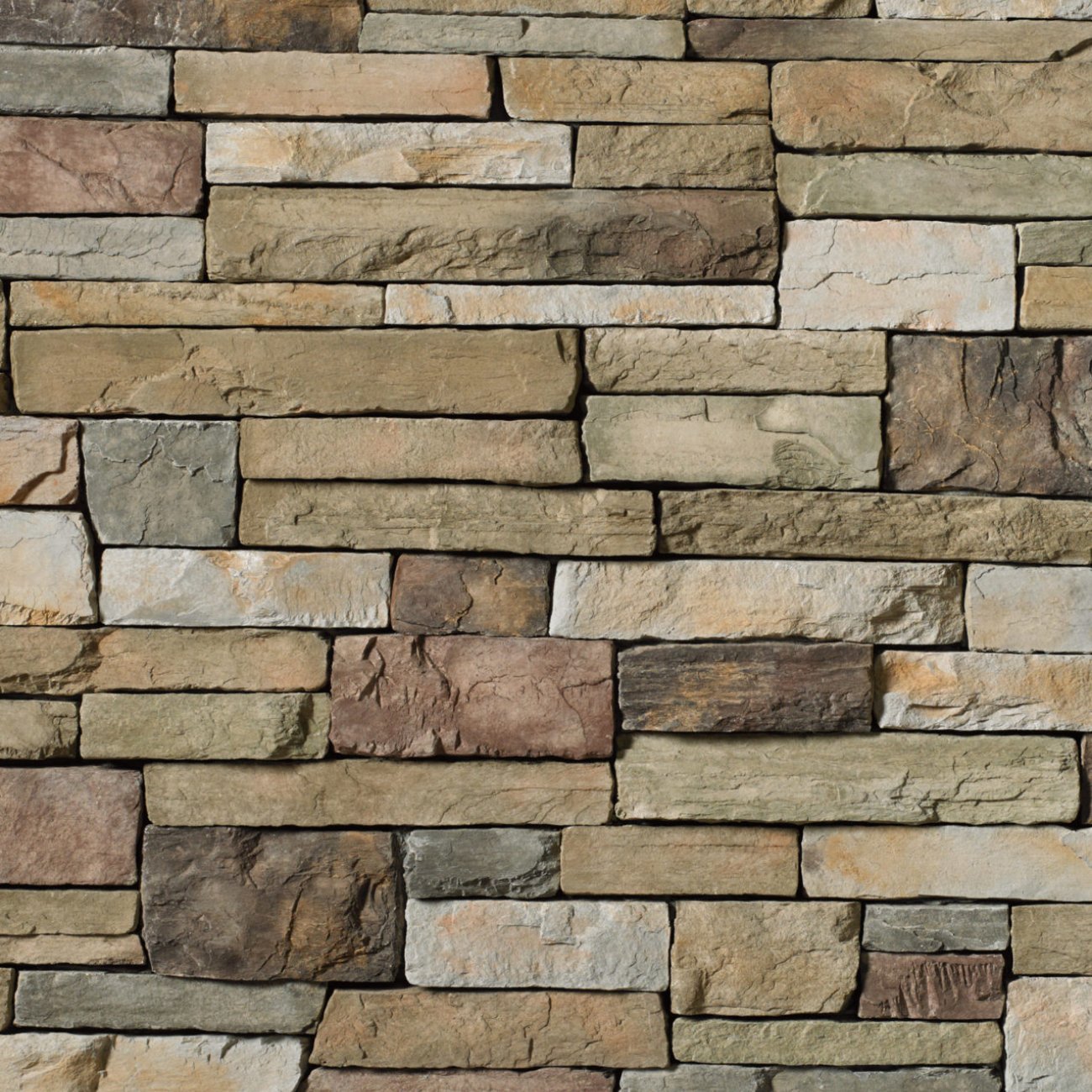 Cultured Stone Bucks County Country Ledgestone veneer featuring earthy brown and gray tones, layered stacked texture, and rugged natural stone character.