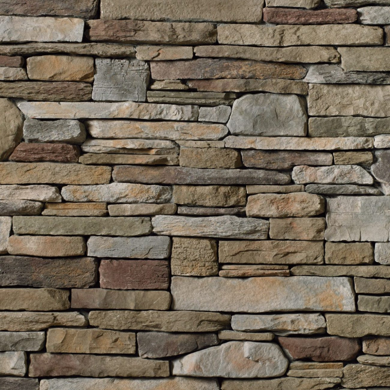 Cultured Stone Bucks County Southern Ledgestone veneer featuring warm tan and beige tones, layered stacked stone texture, and natural stone depth