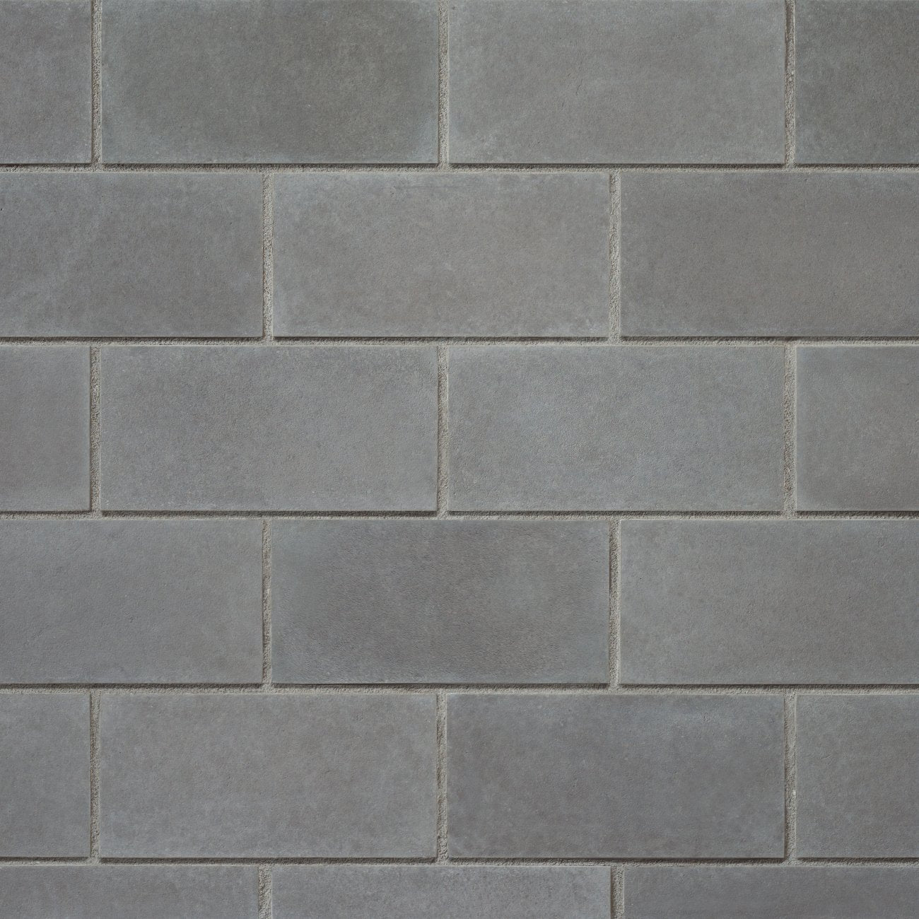 Cultured Stone Carbon Cast-Fit veneer featuring deep charcoal tones, smooth geometric profiles, and modern minimalist stone texture