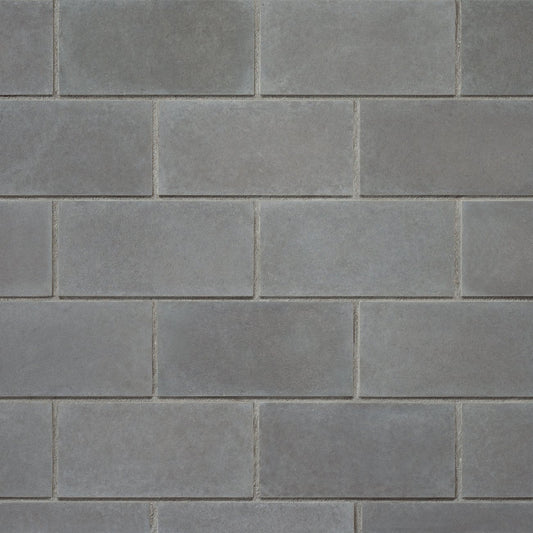 Cultured Stone Carbon Cast-Fit veneer featuring deep charcoal tones, smooth geometric profiles, and modern minimalist stone texture