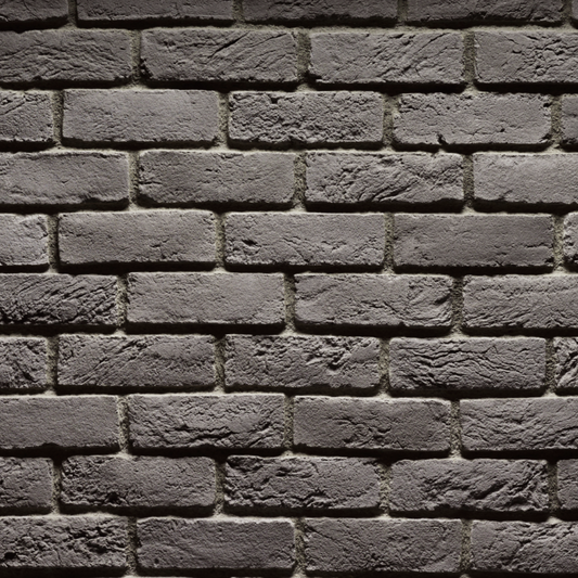 Cultured Stone Carbon handmade brick veneer featuring deep charcoal tones, artisan texture, irregular edges, and rugged brick character