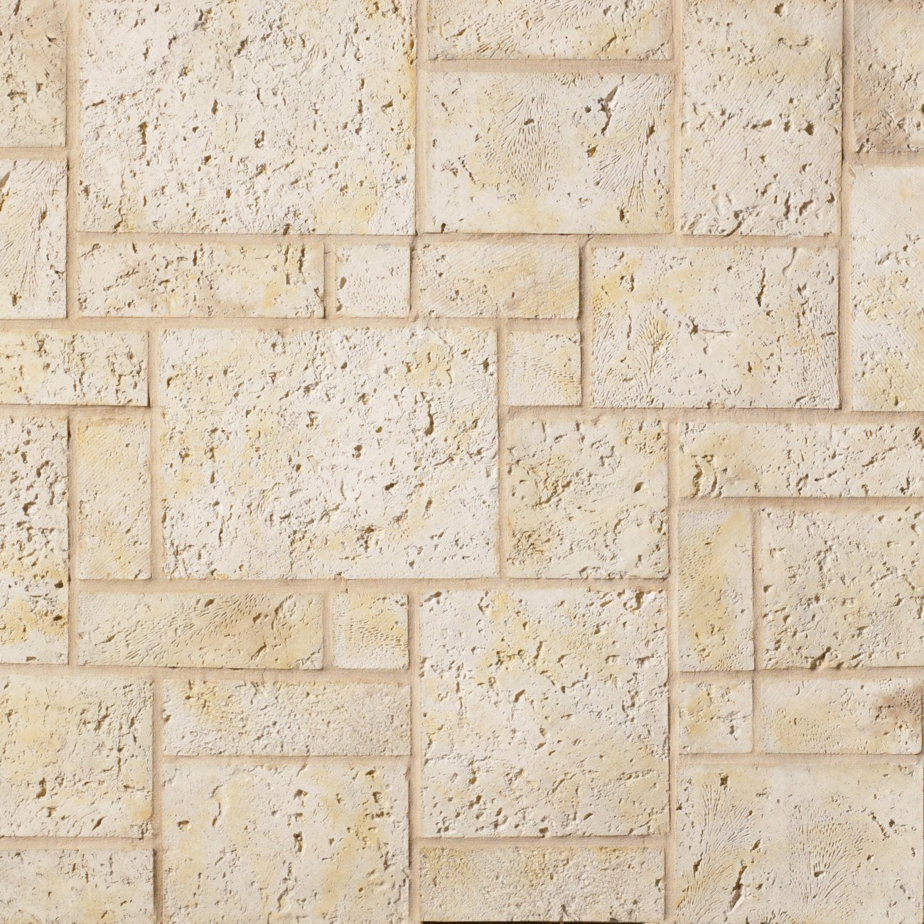 Cultured Stone Fossil Reef Coral Stone veneer featuring warm coastal tones, porous coral texture, and weathered island-inspired stone character