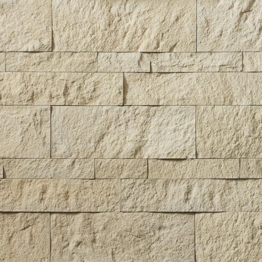 Cultured Stone Foundation Hewn Stone veneer featuring deep earth tones, rugged chiseled hewn texture, and authentic natural stone character.