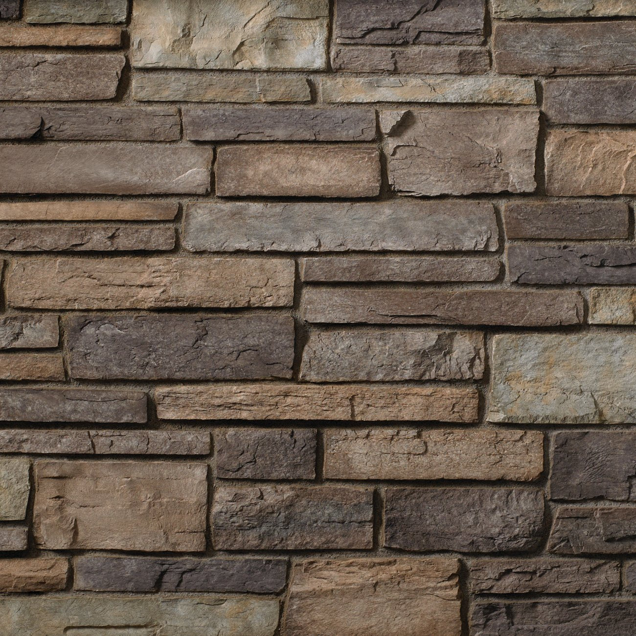 Cultured Stone Grand Mesa Country Ledgestone veneer featuring warm earth-tone color variation, layered stacked texture, and rugged natural stone character.