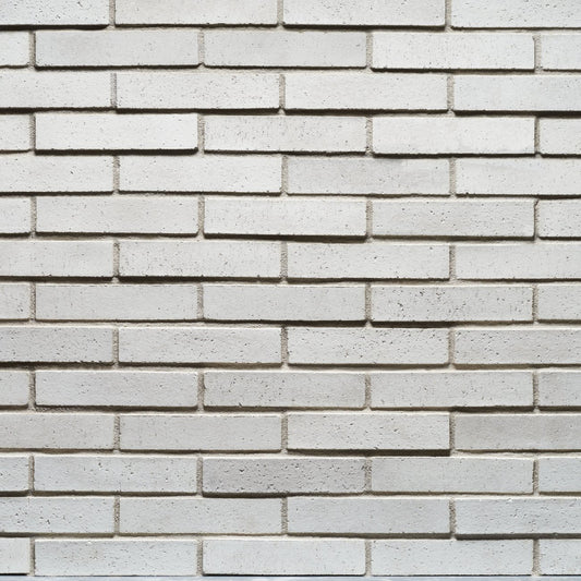 Cultured Stone Loften Tenley Brick veneer featuring soft white and cream tones, slim linear brick profile, and refined masonry texture