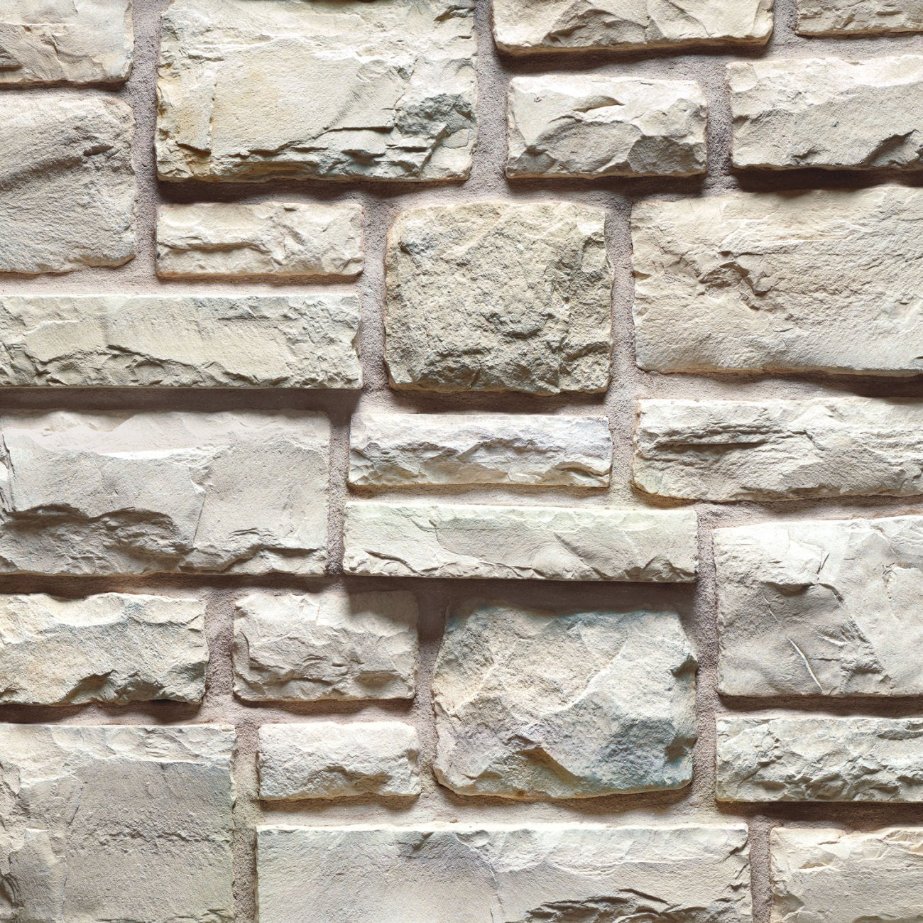 Cultured Stone Salt Flat Cobblefield stone veneer featuring soft light neutral tones, classic cobblestone texture, and bright Old World masonry character