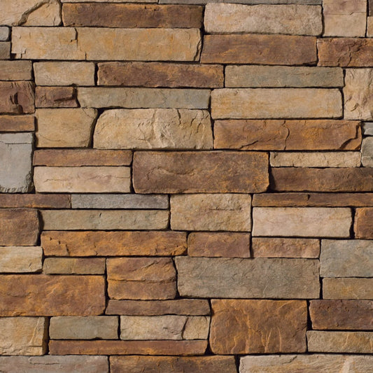 Cultured Stone Sevilla Country Ledgestone veneer featuring warm sun-kissed tones, layered stacked texture, and rugged Mediterranean stone character