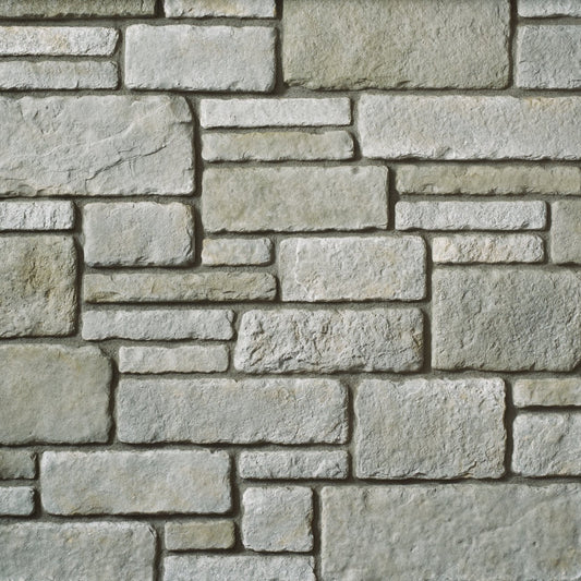 Cultured Stone Silver Shore Sculpted Ashlar veneer featuring light silver-gray tones, refined ashlar stone shapes, and classic masonry texture.