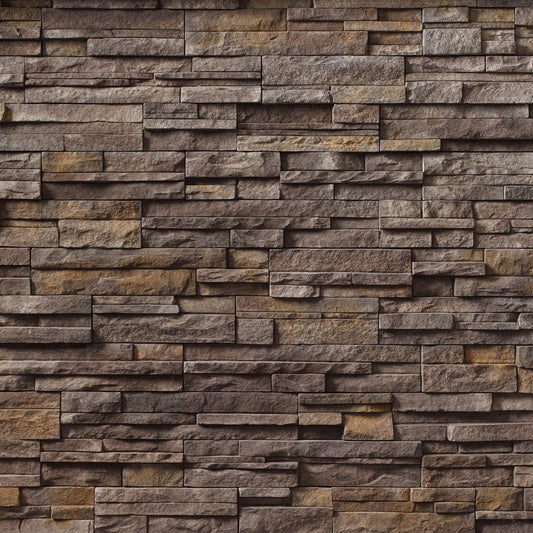 Cultured Stone Umber Creek Pro-Fit Alpine Ledgestone veneer featuring rich brown and gray tones, rugged alpine texture, and layered stone depth.
