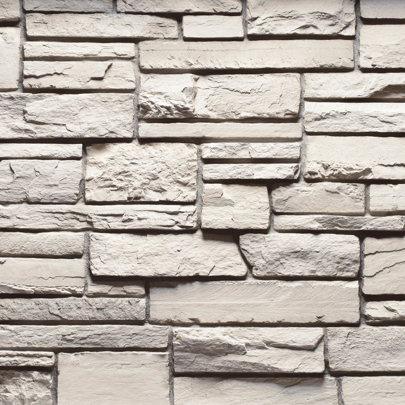 Cultured Stone Wheaton Country Ledgestone veneer featuring warm earthy tones, layered stacked texture, and rugged natural stone character.