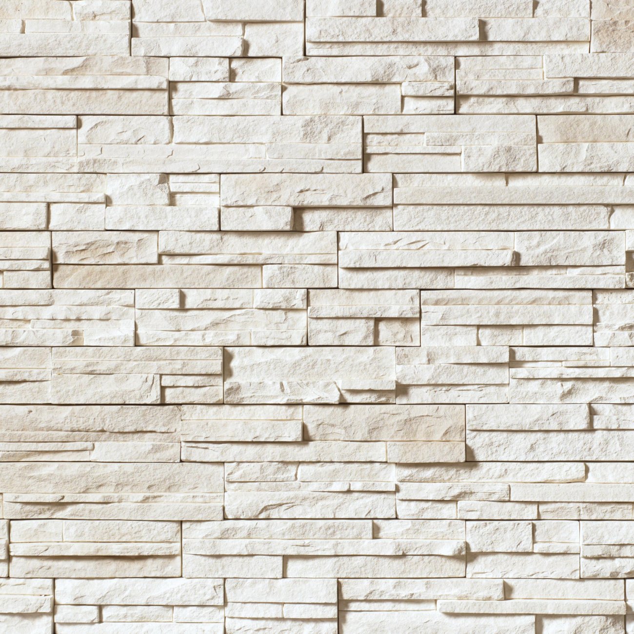 Cultured Stone Winterhaven Pro-Fit Alpine Ledgestone veneer featuring cool white and light gray tones, layered alpine texture, and natural stone depth.