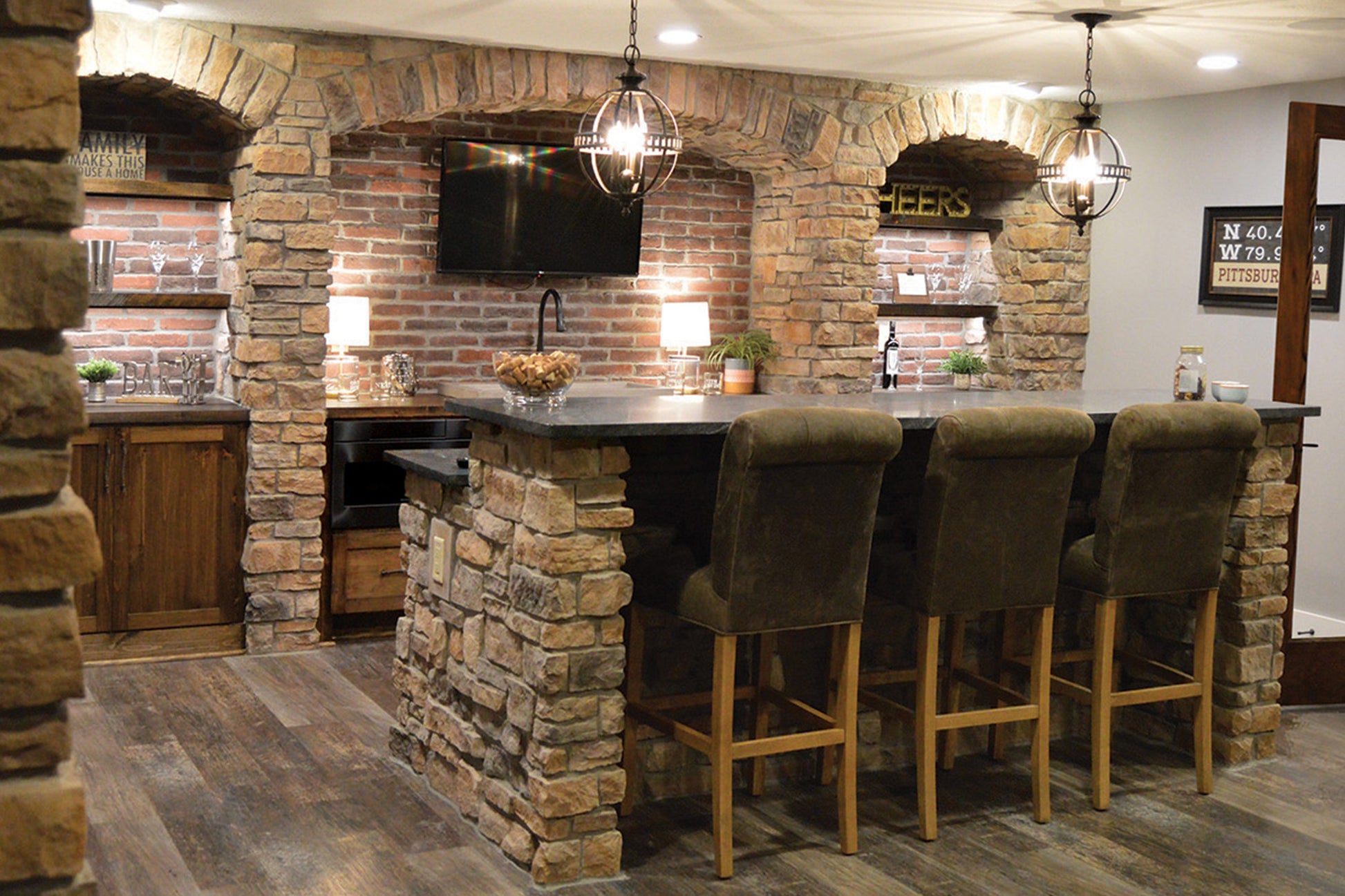 Stone bar with bar stools in a home setting
