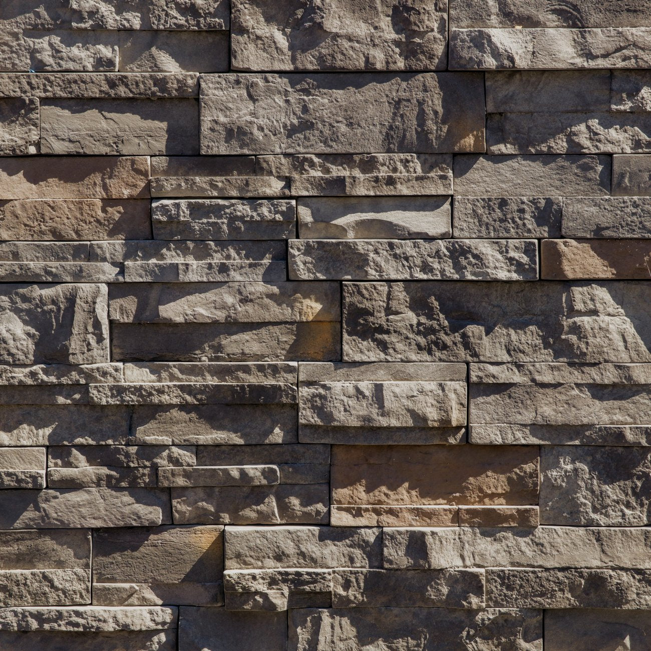Dutch Quality Ashen Dry Stack stone veneer featuring cool gray color blend and natural stacked-stone texture