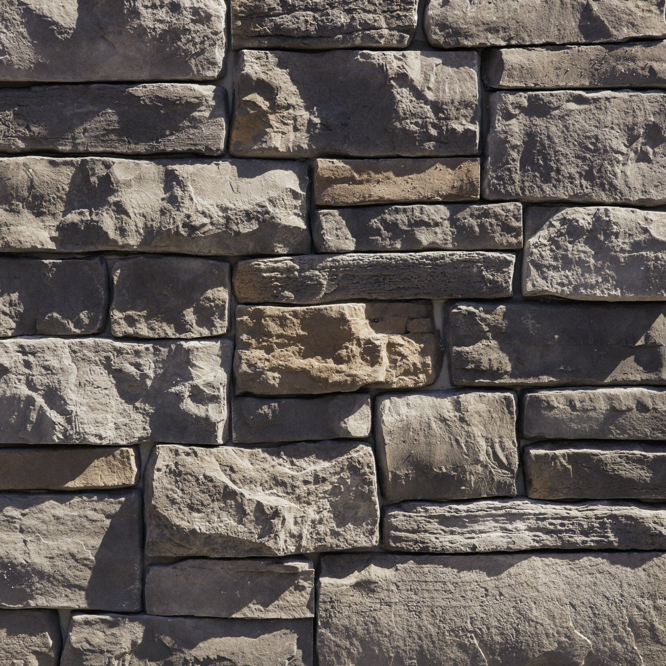 Dutch Quality Ashen Weather Ledge veneer featuring cool gray tones, weathered layered texture, and rugged dimensional ledgestone character.
