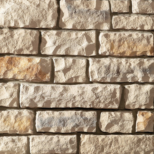 Dutch Quality Columbus Blend Limestone veneer featuring neutral gray and tan tones, chiseled limestone texture, and classic rectangular stone profiles