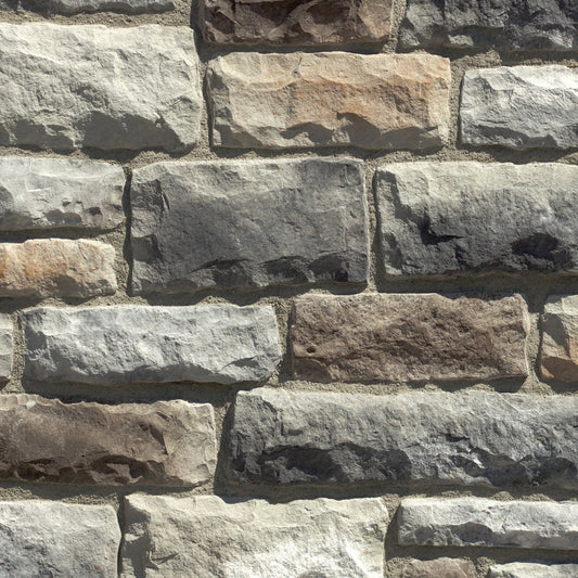 Dutch Quality Elkwood Limestone veneer featuring warm brown and taupe tones, chiseled limestone texture, and classic rectangular stone profiles