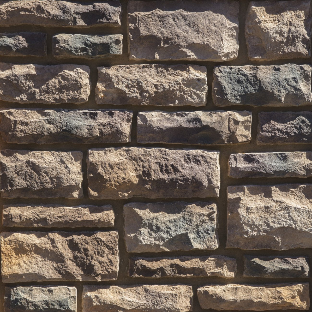 Dutch Quality Pennsylvania Limestone veneer featuring earthy brown and gray tones, chiseled limestone texture, and classic rectangular stone profiles