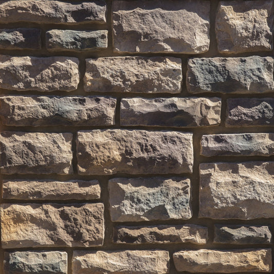 Dutch Quality Pennsylvania Limestone veneer featuring earthy brown and gray tones, chiseled limestone texture, and classic rectangular stone profiles