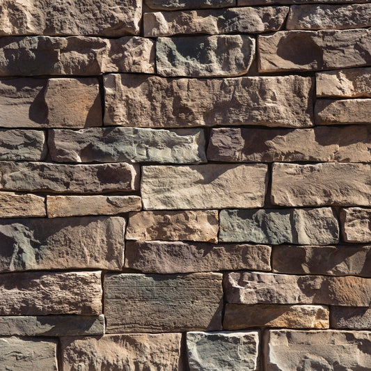 Dutch Quality Pennsylvania Weather Ledge veneer featuring earthy brown and gray tones, weathered layered texture, and rugged dimensional ledgestone character.