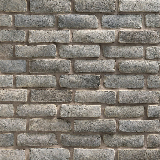 Dutch Quality Quail Grey Handformed Brick veneer featuring soft gray tones, handcrafted texture, and natural artisan brick detailing