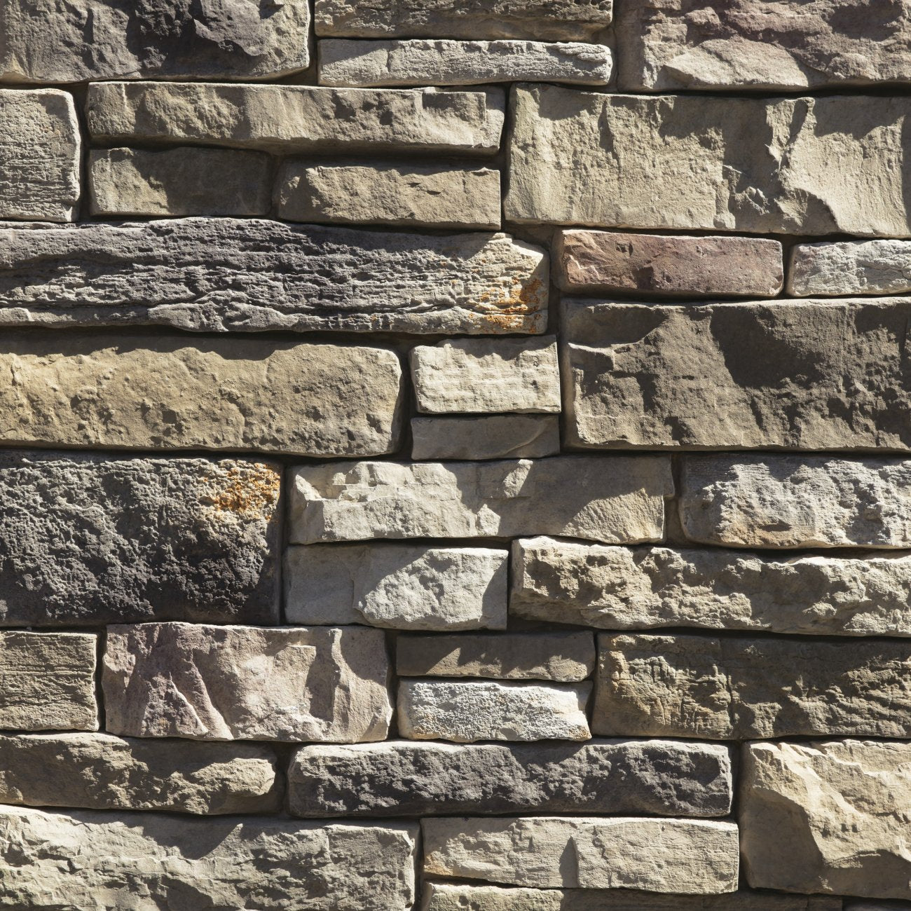Dutch Quality Sagewood Weather Ledge veneer featuring warm earth tones, weathered layered texture, and rugged dimensional ledgestone character.