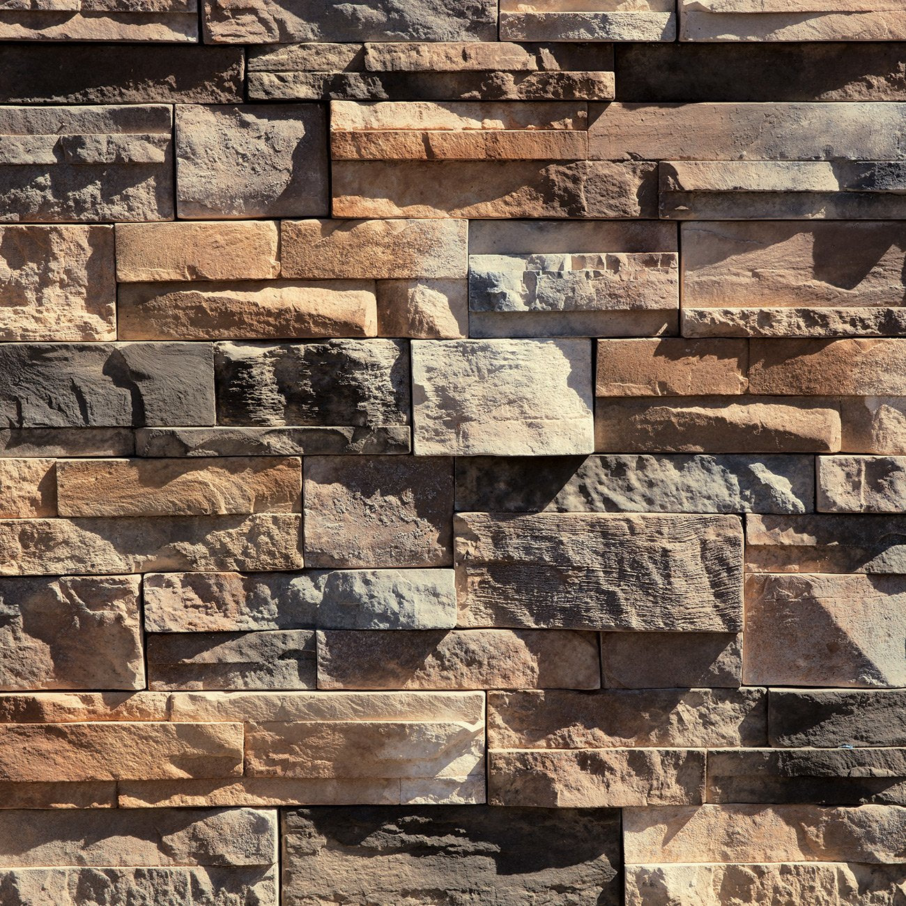 Dutch Quality Sienna Dry Stack stone veneer featuring warm sienna color blend and rugged stacked-stone texture