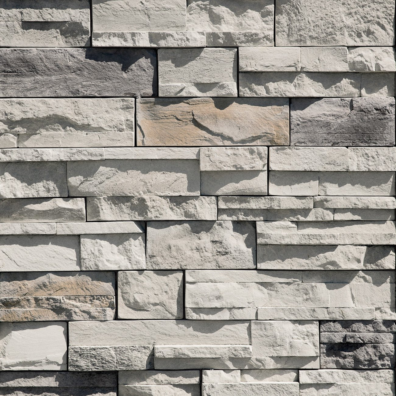 Dutch Quality Winter Point Dry Stack stone veneer featuring cool gray color blend and natural stacked-stone texture