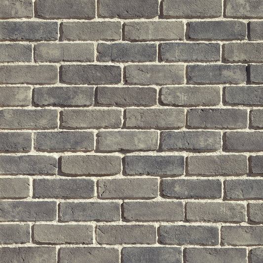 Eldorado Ashland TundraBrick thin brick-style stone veneer in soft gray, taupe, and brown tones with textured surface