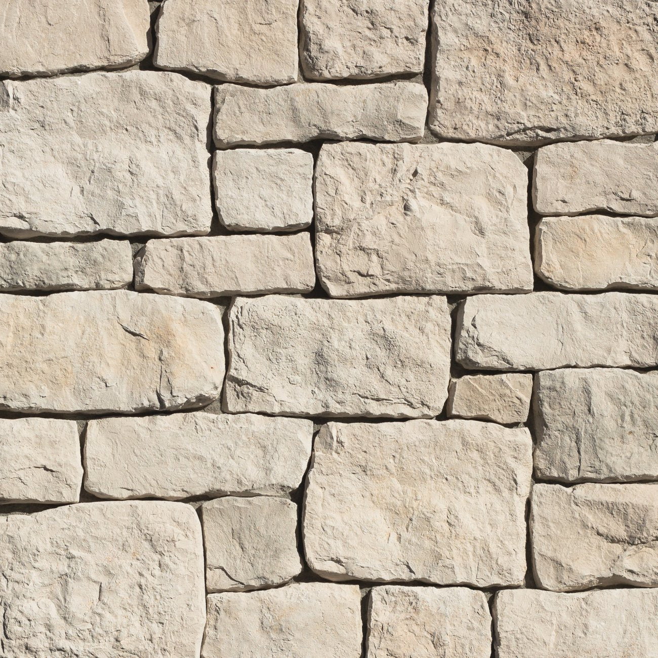 Eldorado Casa Blanca RoughCut stone with rugged chiseled texture in soft white and cream tones