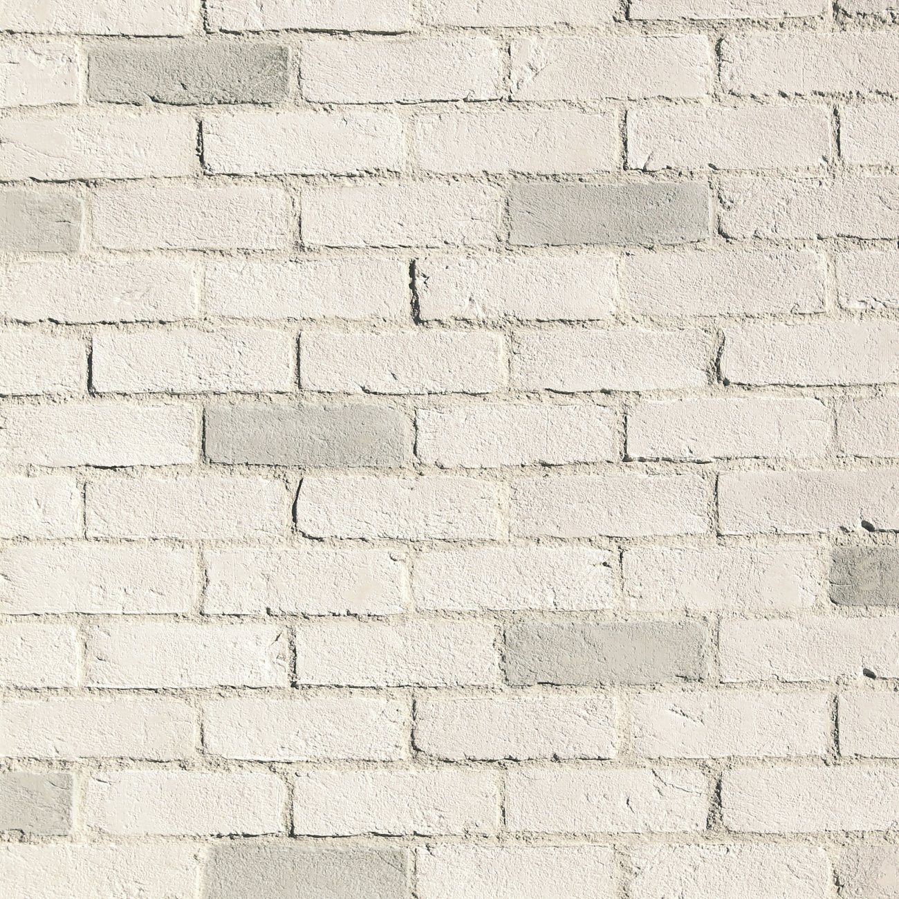 Eldorado Chalk Dust TundraBrick thin brick-style stone veneer in soft white, pale gray, and cream tones with subtle texture