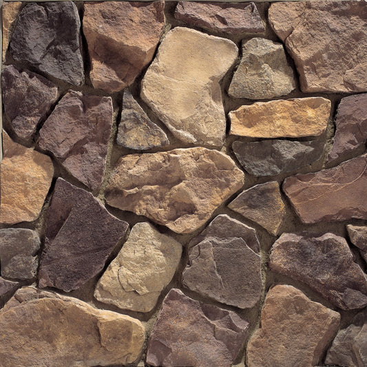 Eldorado Cognac Country Rubble stone veneer in warm brown and golden hues with rustic, hand-laid fieldstone texture