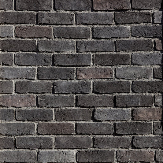 Eldorado Ironside TundraBrick thin brick-style stone veneer in deep gray, charcoal, and brown tones with textured surface
