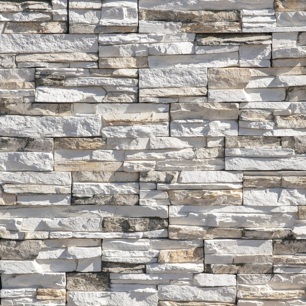 Eldorado Koryak Ridge Stacked Stone with tightly fitted linear stones in deep charcoal, slate gray, and brown tones