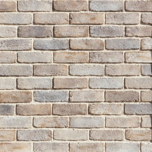 Eldorado Latigo TundraBrick thin brick-style stone veneer in warm brown, tan, and taupe tones with subtle texture