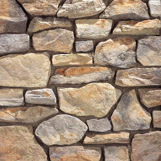 Eldorado Lucera Hillstone stone veneer in warm tan and gray tones with rugged, weathered hillside stone texture