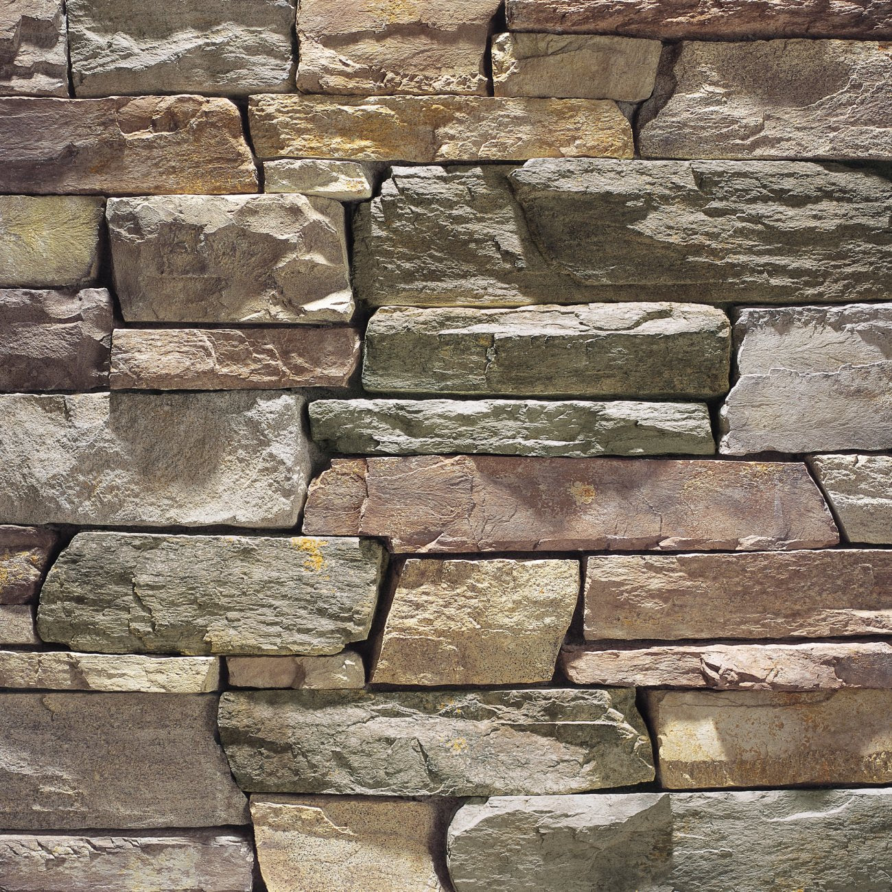 Eldorado Manzanita Cliffstone stone veneer in deep brown and red tones with rugged ledgestone texture