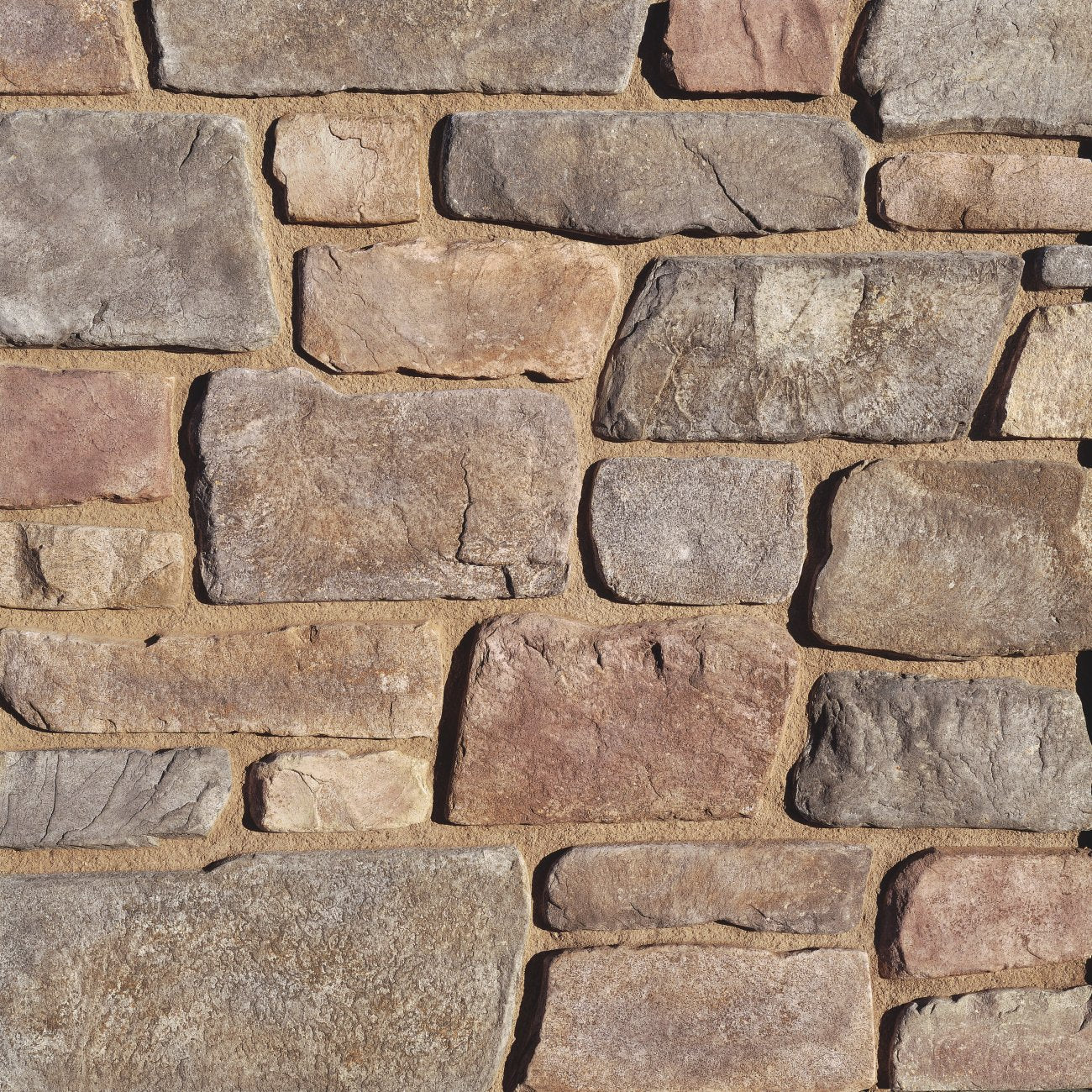 Eldorado Meseta Fieldledge stone veneer in warm tan and gray tones with rugged, weathered fieldstone texture