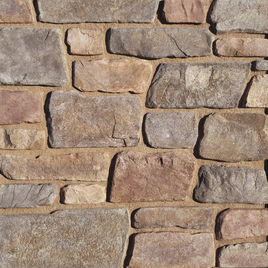 Eldorado Meseta Fieldledge stone veneer in warm tan and gray tones with rugged, weathered fieldstone texture