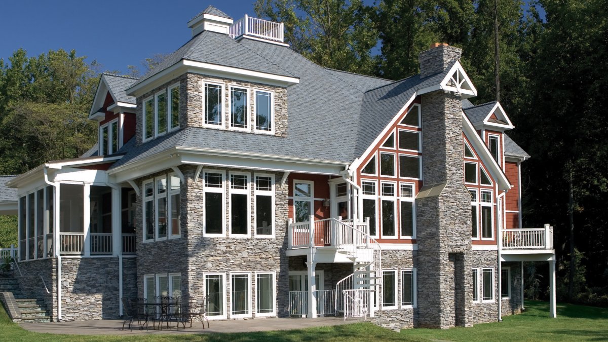 Home exterior finished with Eldorado Mineret Bluffstone stone veneer in warm earth tones