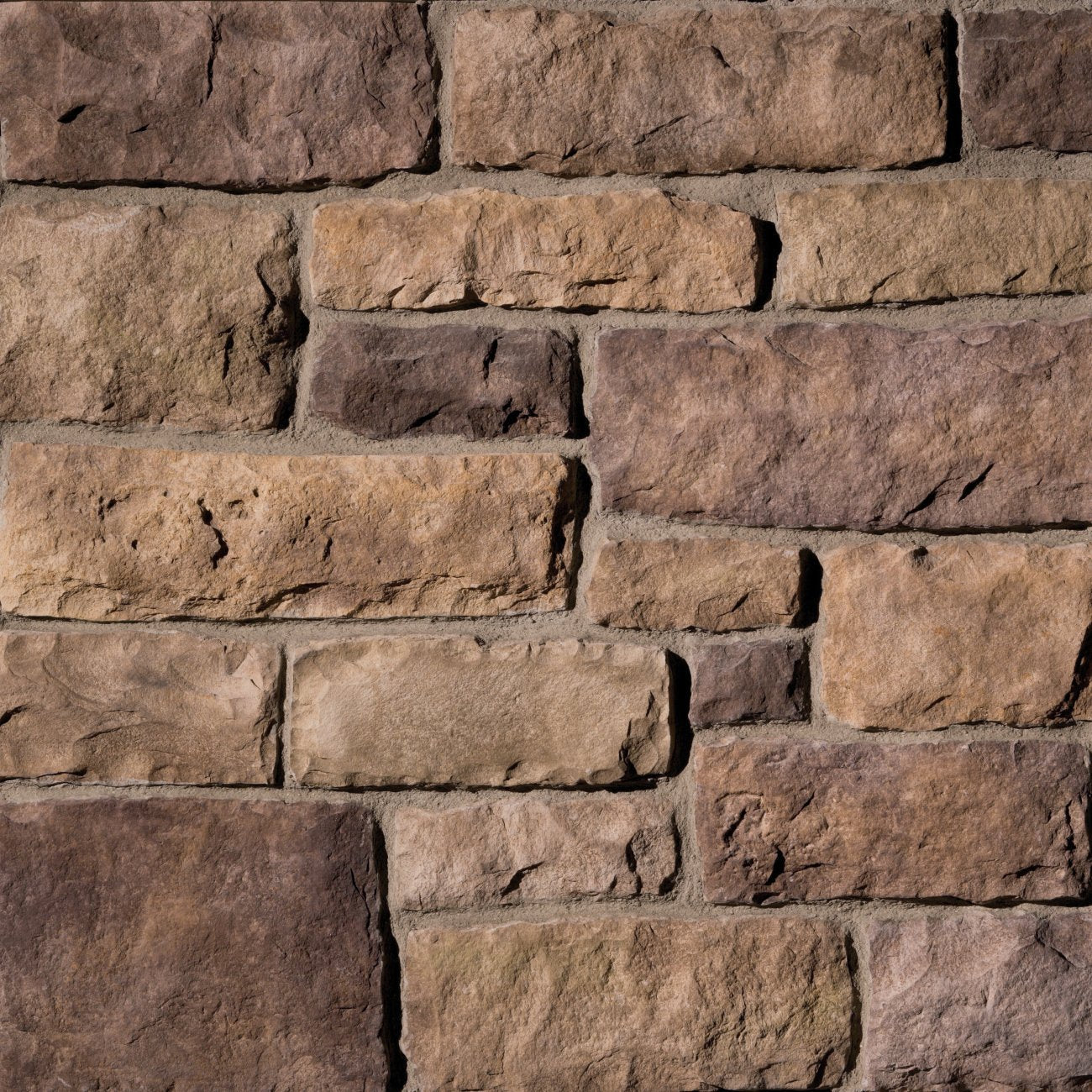 Eldorado New Haven Limestone stone veneer in cool gray and charcoal tones with refined, chiseled limestone texture