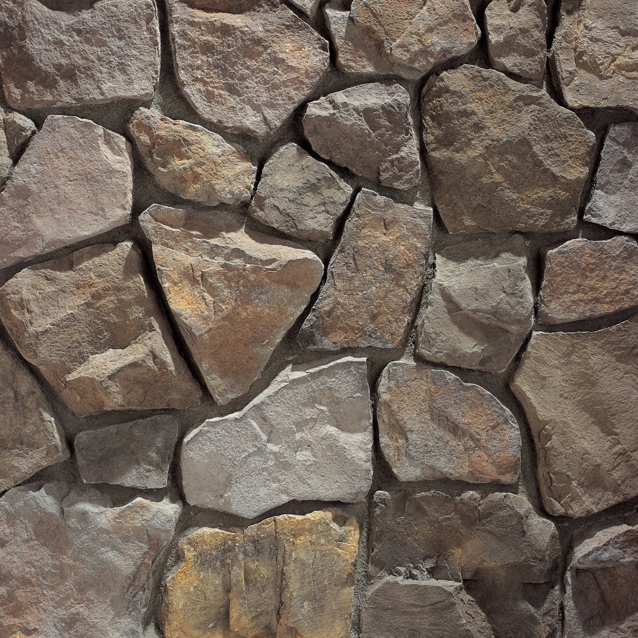 Eldorado Polermo Country Rubble stone veneer in cream, tan, and gray hues with rustic, irregular fieldstone texture