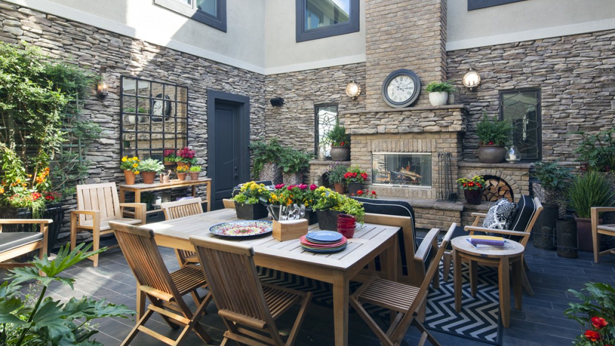 House with Eldorado Prescott Bluffstone stone veneer siding showcasing authentic stacked-stone texture