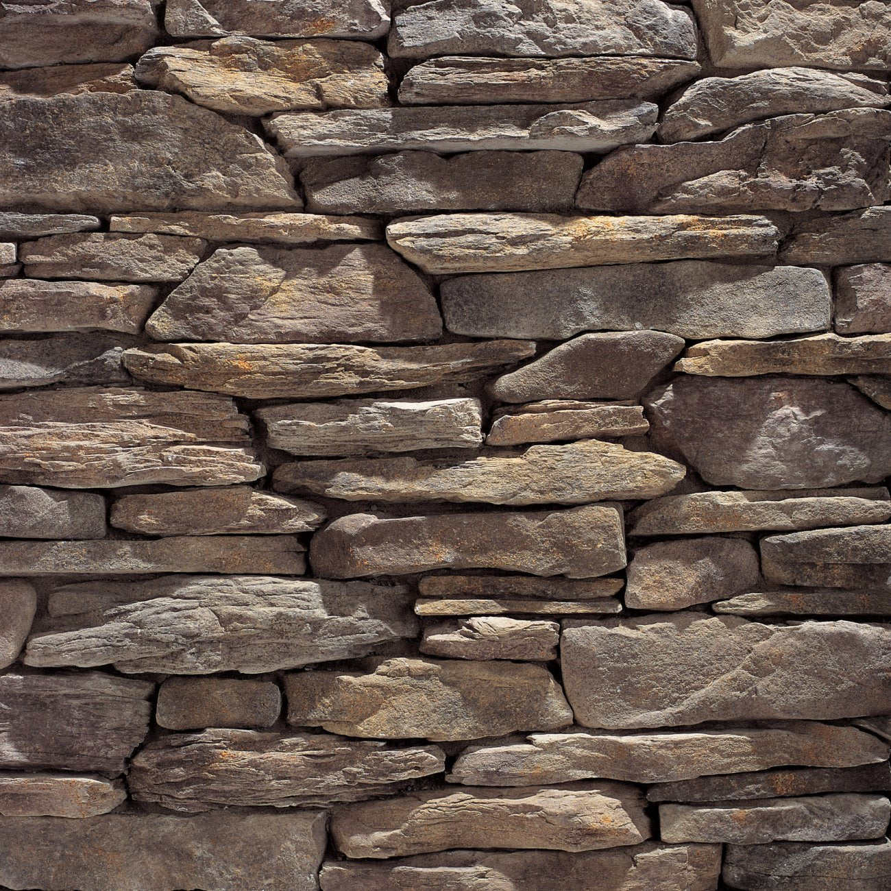 Eldorado Prescott Bluffstone stone veneer in warm earth tones with natural stacked texture