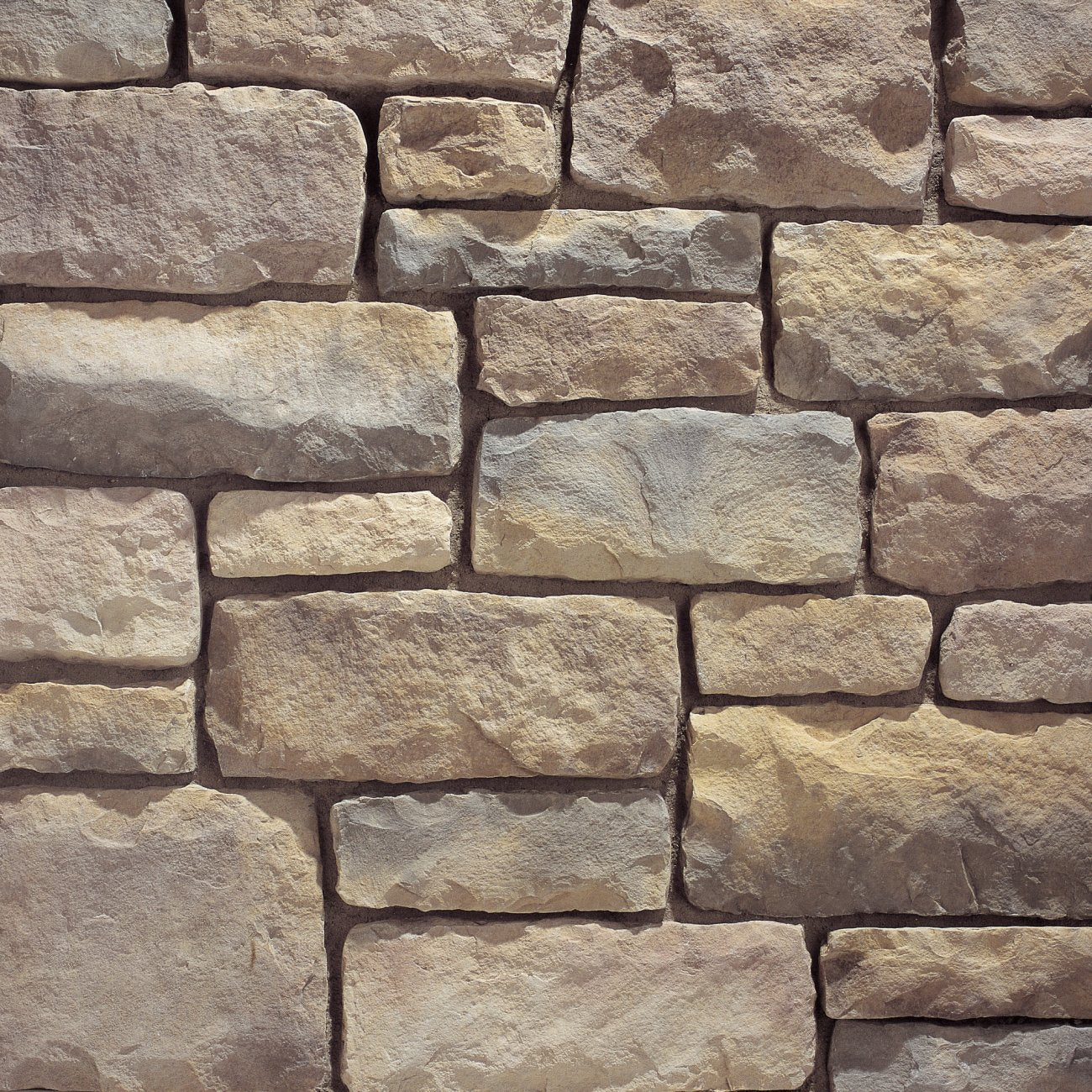 Eldorado San Marino Limestone stone veneer in soft cream and warm gray tones with refined, chiseled limestone texture