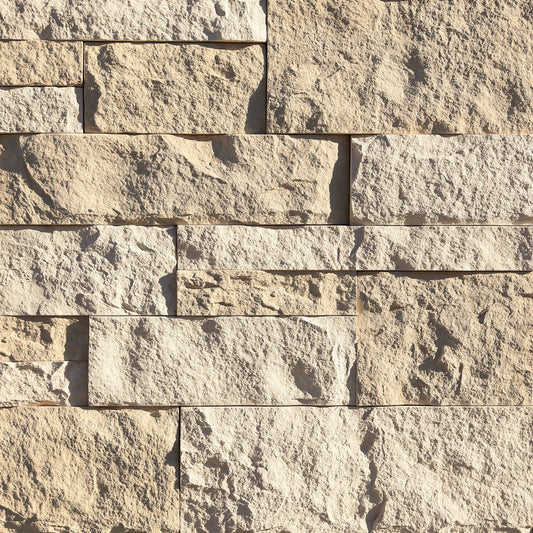 Eldorado Seashell Cut Coarse Stone veneer in cream and beige hues with linear, split-face stone texture