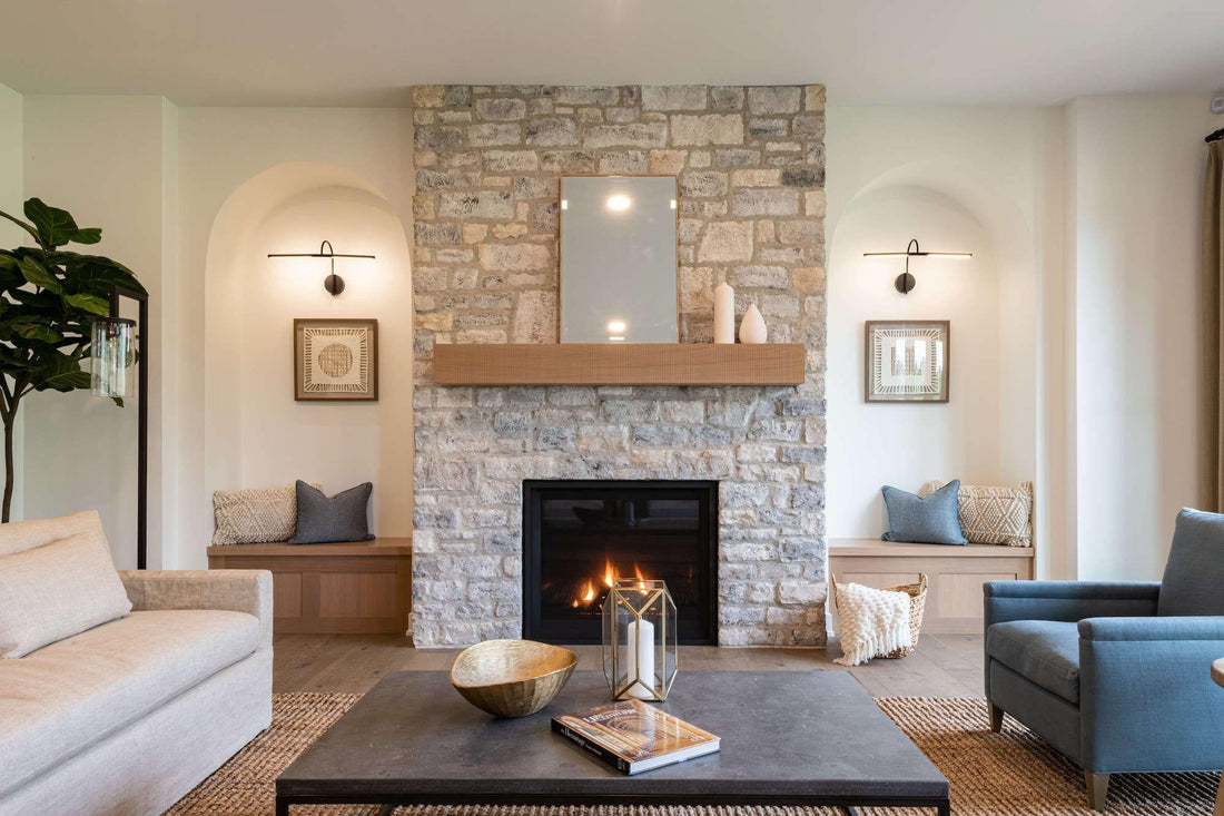 Light limestone fireplace with a wood mantel between built-in seating alcoves, featuring Eldorado Grand Banks Limestone.