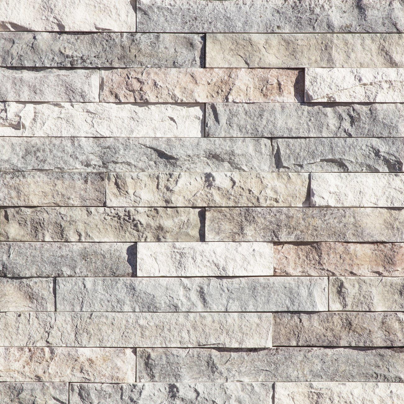Eldorado Whitecap LedgeCut33 stone veneer in soft white and creamy neutral tones with a modern stacked-stone profile