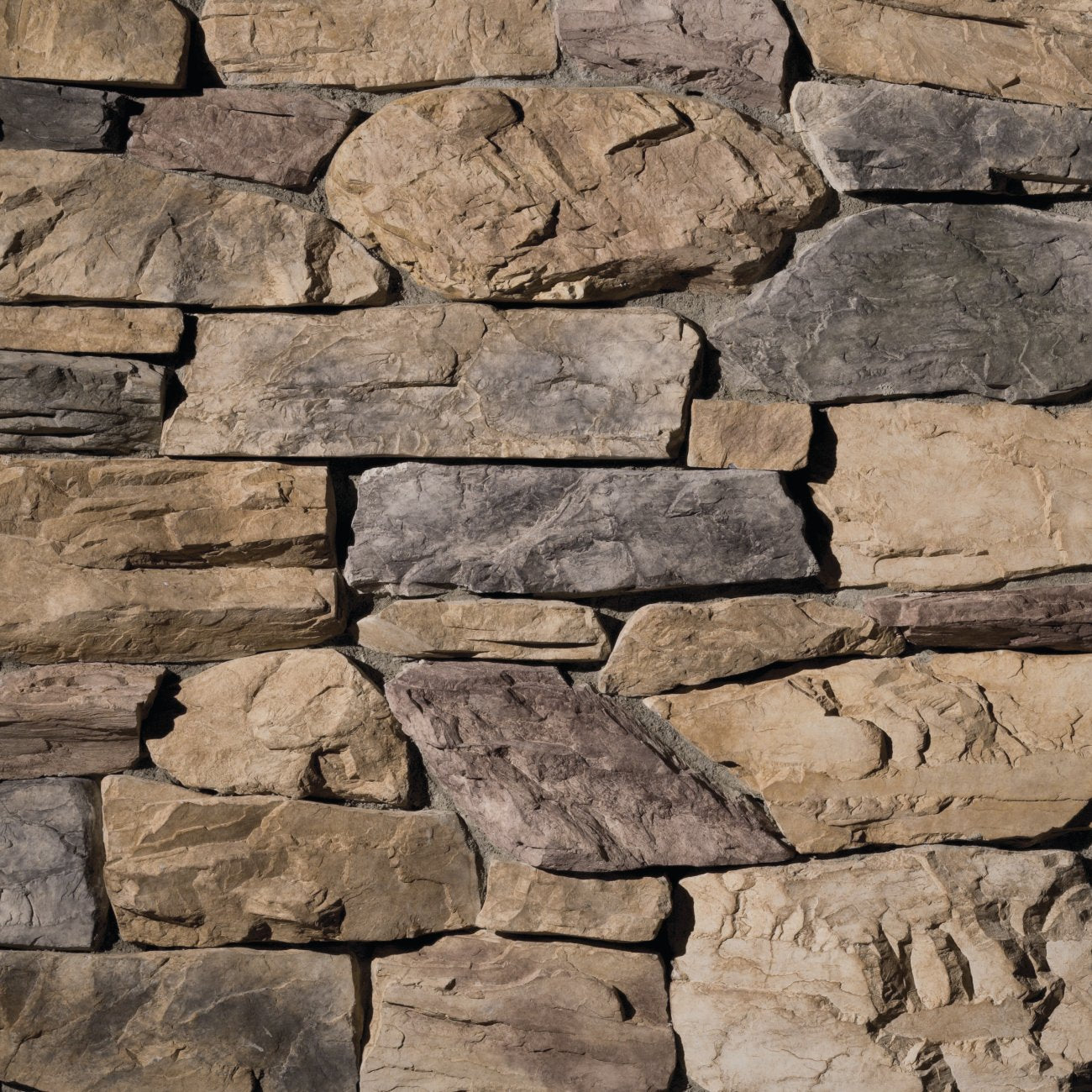Eldorado Willow Shadow Rock with rugged, irregular stone faces in soft brown, warm gray, and taupe tones